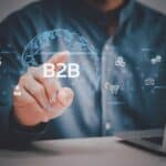 Ręka człowieka za pomocą wirtualnego ekranu laptopa B2B Ikony i symbole Business to Business Biznesowa technologia cyfrowa marketingowa koncepcja online